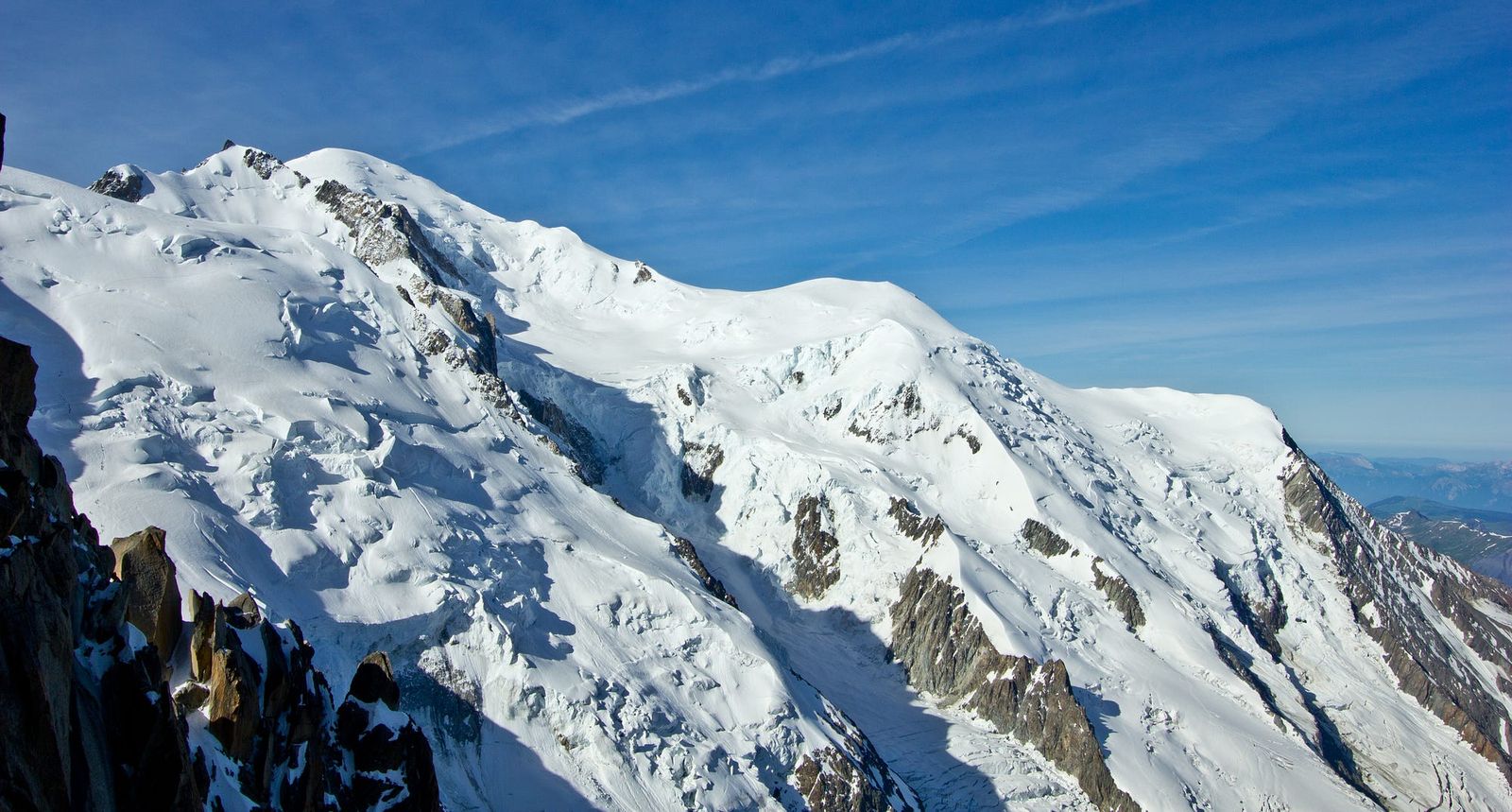 The interesting part of the climb starting from the rocky ridge (Goutier Ridge) on the far right up over the snowy bulge (Dome du Goutier) past the two little humps (Camel Humps) up to the summit on the left at the back