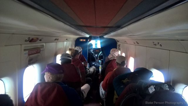 Inside the tiny cabin. The stewardess walked down the aisle handing out throat lozenges and cotton wool buds for our ears