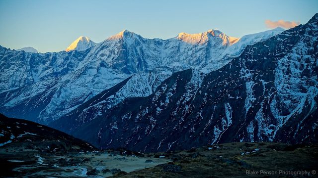 Sun starting to glow on the peaks behind us