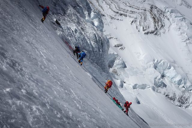 A ‘Body team’ lowing a body down the Lhotse Face